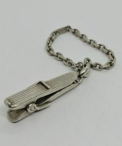 Porte-clef en forme de pince à linge, argent massif signé Hermès Paris.