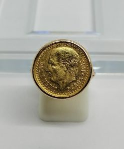Bague en or , montée avec un pesso mexicain, 1950.